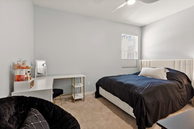 bedroom featuring light colored carpet and ceiling fan