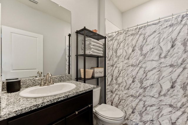 bathroom with vanity and toilet