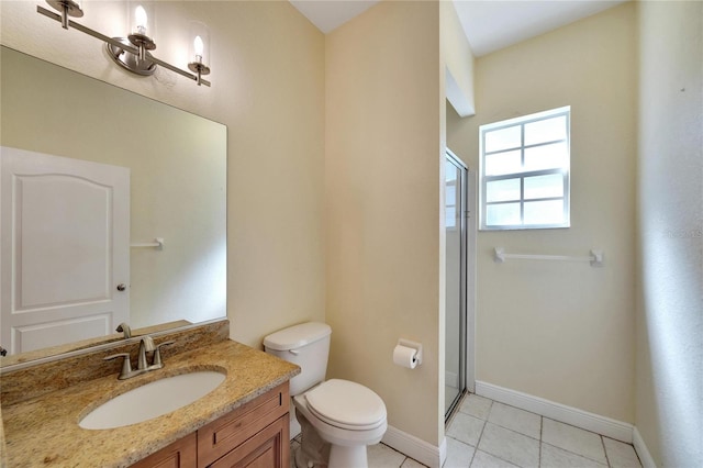 bathroom featuring toilet, vanity, tile patterned floors, and walk in shower