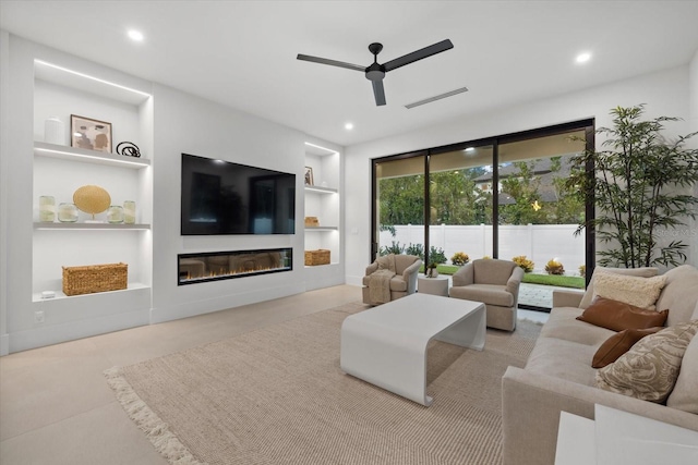 living area with ceiling fan, recessed lighting, visible vents, built in features, and a glass covered fireplace