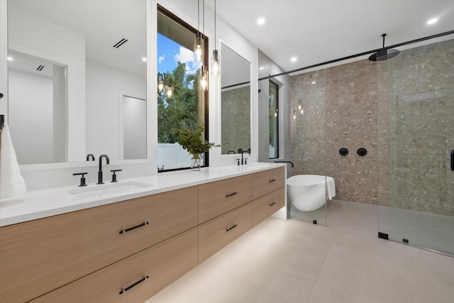 full bathroom featuring tile patterned flooring, a shower with shower door, a sink, visible vents, and double vanity