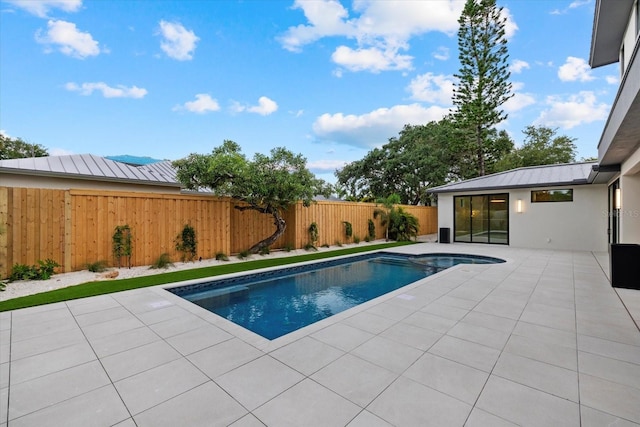 view of pool featuring a fenced in pool, a patio area, and a fenced backyard