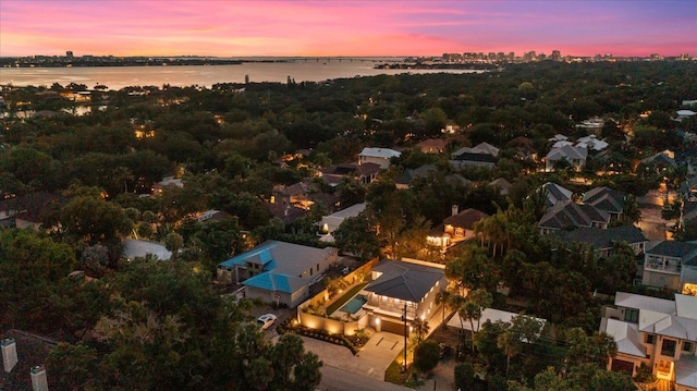 birds eye view of property with a water view and a residential view