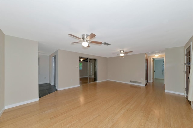 unfurnished living room featuring light hardwood / wood-style floors and ceiling fan