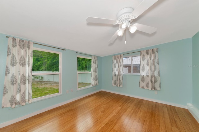 unfurnished room featuring light hardwood / wood-style floors and ceiling fan