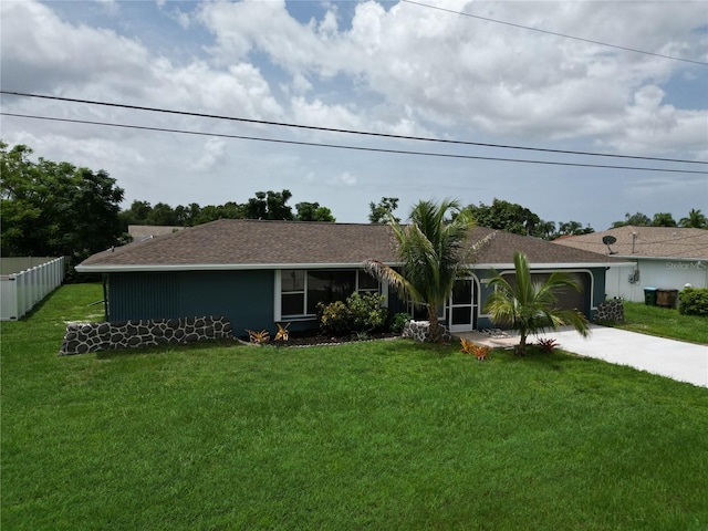 ranch-style home featuring a garage and a front yard