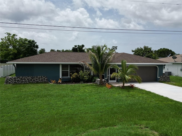 ranch-style house with a front lawn, cooling unit, and a garage