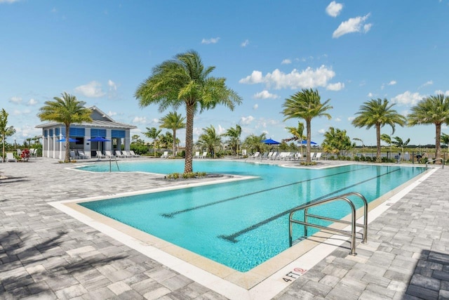 view of swimming pool with a patio