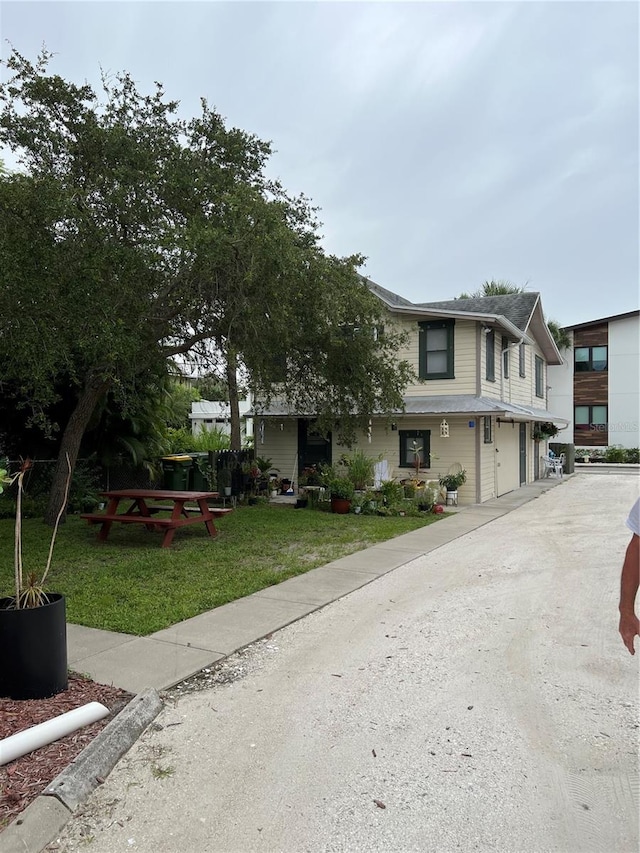 view of front of home featuring a garage and a front lawn