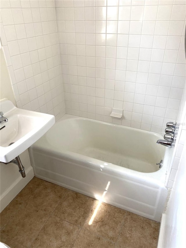 bathroom with tile patterned flooring and shower / bathing tub combination