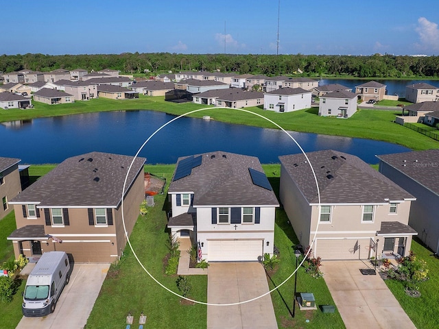 drone / aerial view with a water view