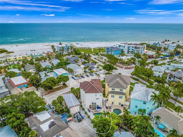 drone / aerial view featuring a view of the beach and a water view