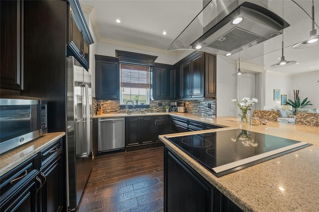 kitchen featuring island range hood, crown molding, backsplash, and stainless steel appliances