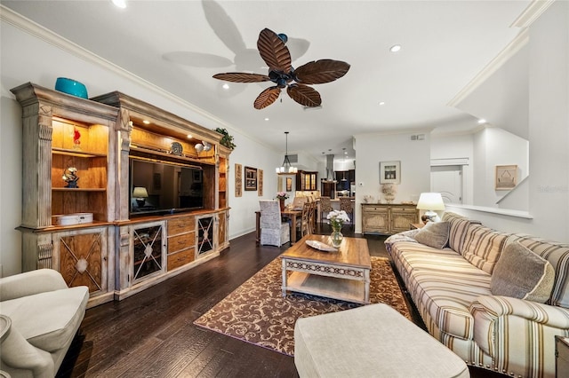 living room featuring ceiling fan, crown molding, and dark wood-type flooring