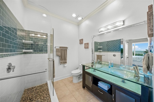 bathroom with a shower with door, toilet, vanity, tile patterned floors, and ornamental molding