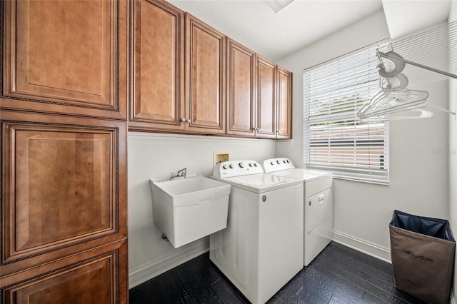 laundry area with sink, cabinets, washing machine and dryer, and dark hardwood / wood-style floors