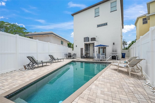 view of swimming pool with a patio area