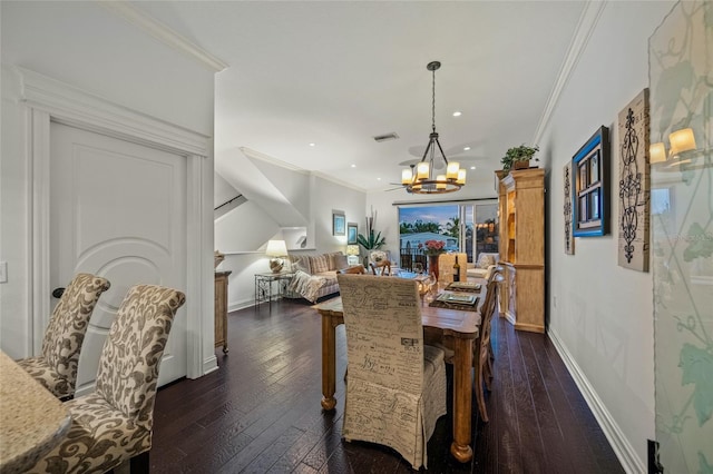 dining space with a notable chandelier, ornamental molding, and dark wood-type flooring