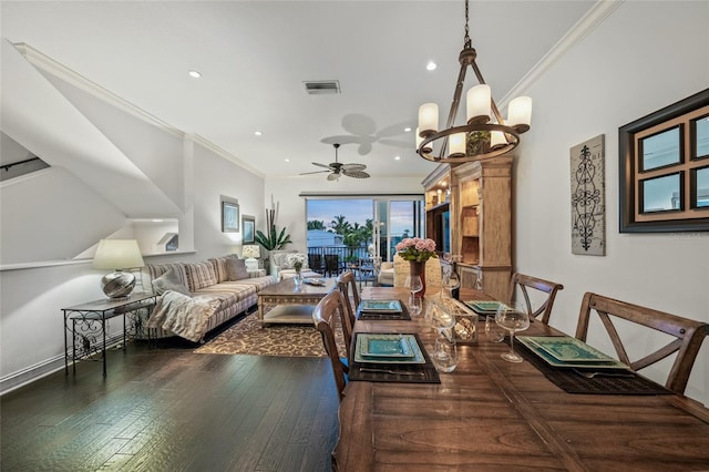 dining space featuring dark hardwood / wood-style floors, ceiling fan with notable chandelier, and crown molding