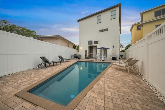 view of pool with a patio and area for grilling