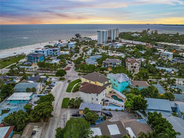 aerial view at dusk with a water view