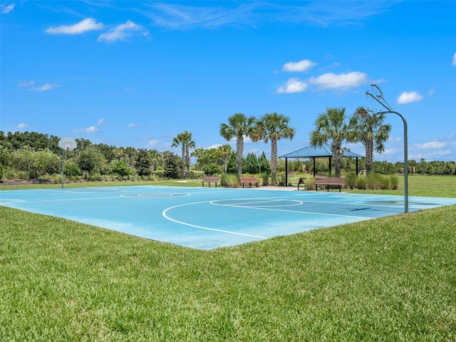 view of sport court with a gazebo and a yard