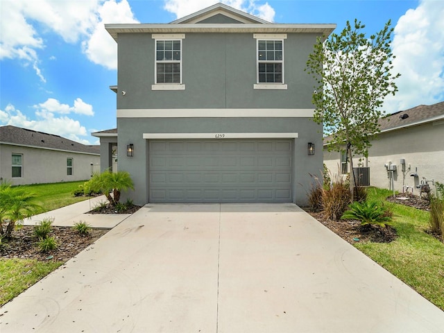 front of property with a garage