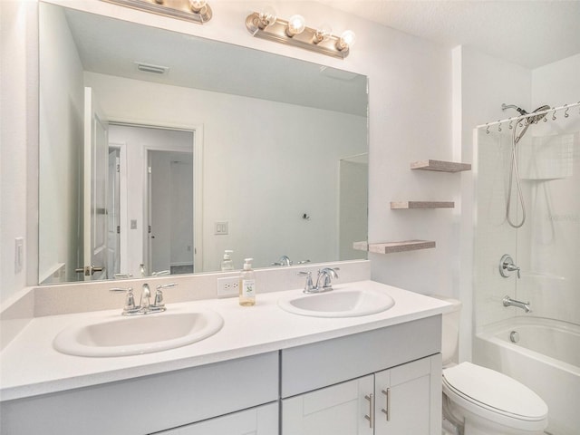 full bathroom featuring vanity, toilet, and  shower combination