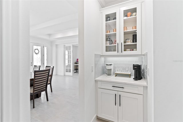 bar with a raised ceiling and backsplash