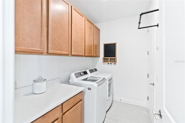 laundry room with cabinets and independent washer and dryer