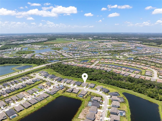 bird's eye view with a water view and a residential view