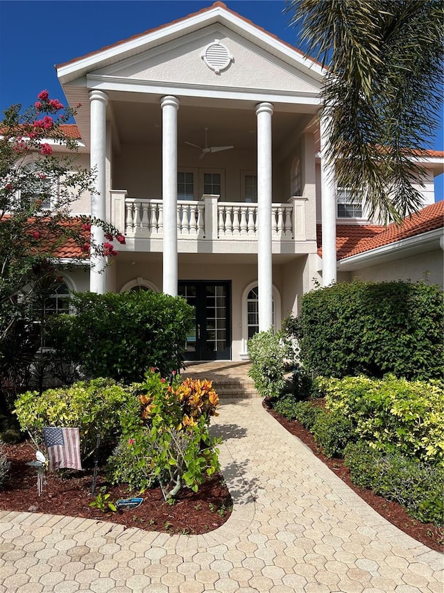 greek revival house featuring a balcony