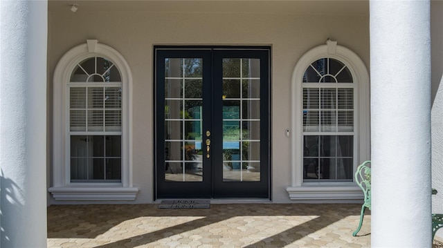 property entrance featuring french doors