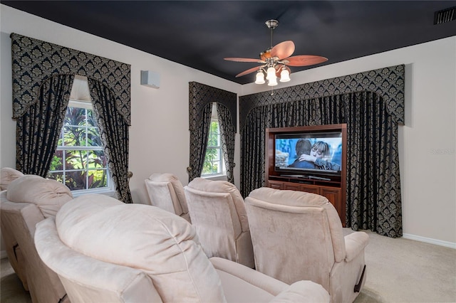 cinema with carpet floors and ceiling fan