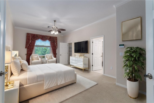 carpeted bedroom featuring ornamental molding and ceiling fan