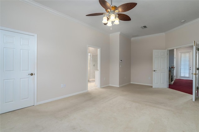 unfurnished bedroom with ensuite bathroom, light carpet, ceiling fan, and ornamental molding