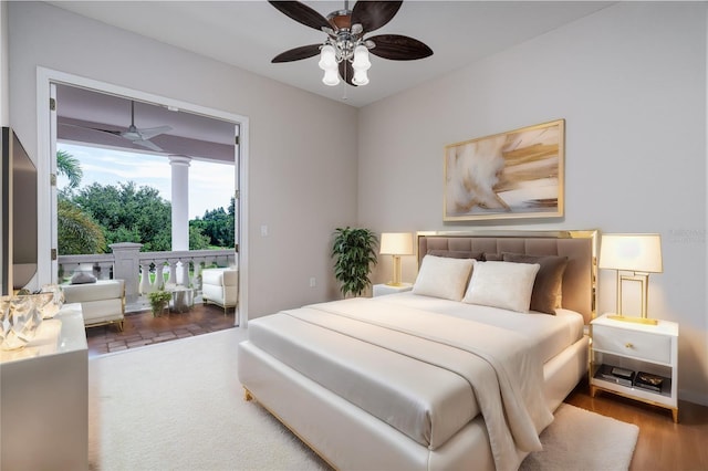 bedroom with dark hardwood / wood-style flooring and ceiling fan