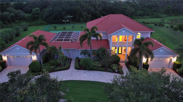 view of front of house with a garage and a front yard