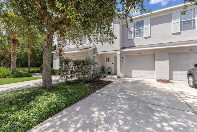 townhome / multi-family property featuring a garage