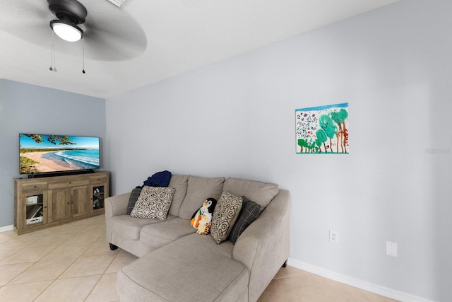 tiled living room with ceiling fan