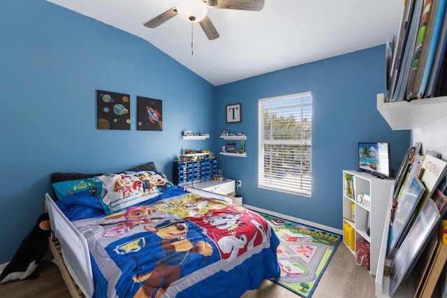 bedroom featuring vaulted ceiling, wood-type flooring, and ceiling fan