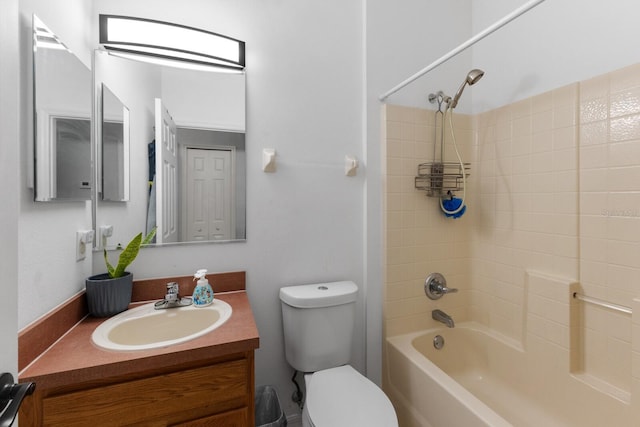 full bathroom featuring vanity, washtub / shower combination, and toilet