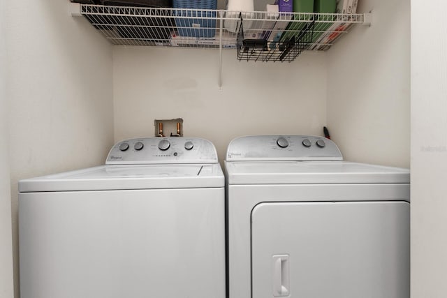 laundry area with washing machine and dryer