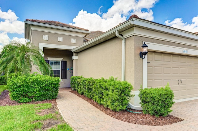 property entrance with a garage