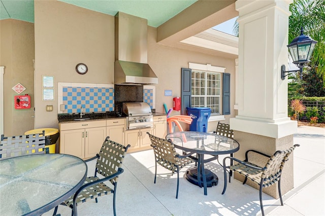 view of patio featuring area for grilling, a grill, and sink