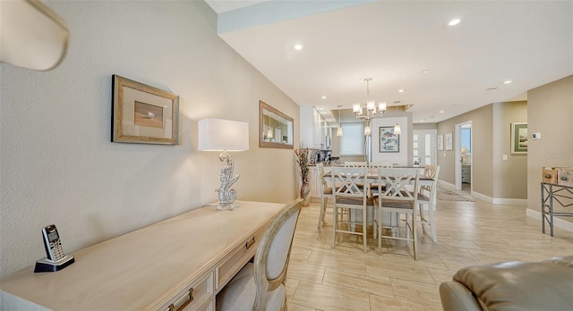 tiled dining space featuring an inviting chandelier