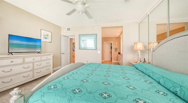 bedroom with a closet, ceiling fan, and carpet floors