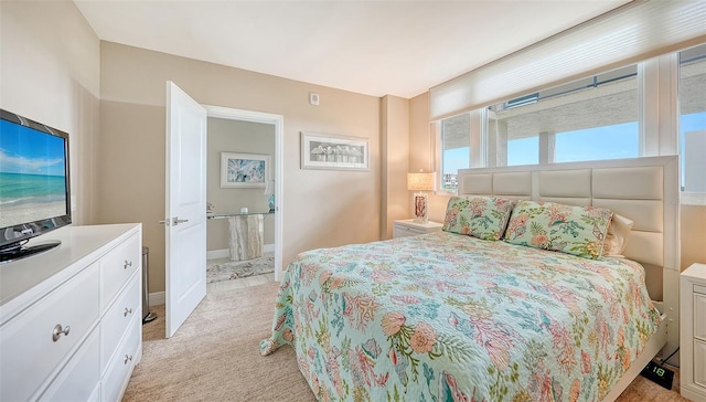 bedroom featuring light colored carpet