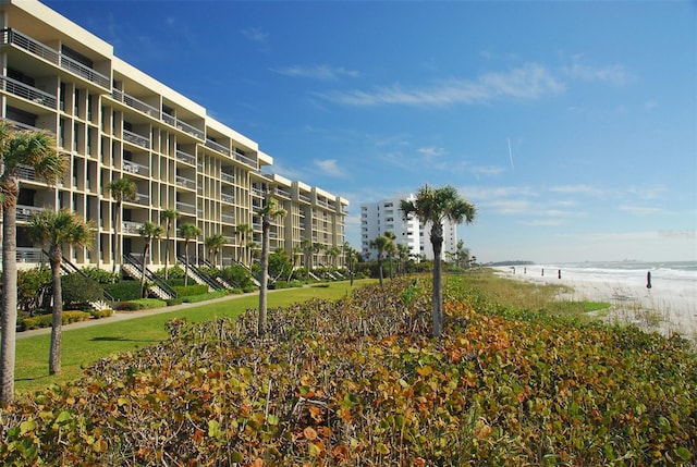 exterior space with a water view and a yard