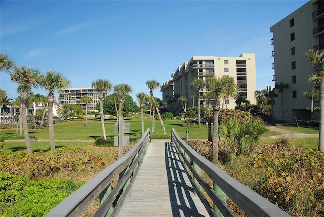 view of home's community with a lawn